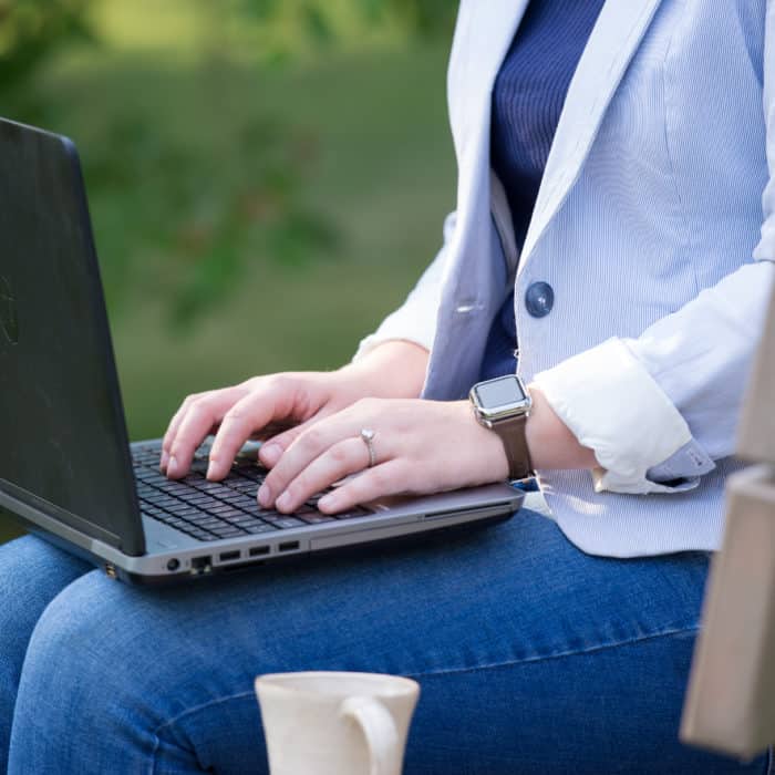 man typing on laptop